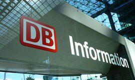 A cloesup of the DB logo with the text "Information" printed onto a glass window A cloesup of the DB logo with the text "Information" printed onto a glass window