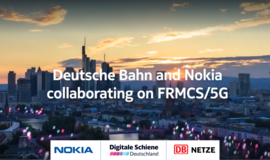 Foto von Frankfurter Skyline. Im Vordergrund des Fotos steht: Digitale Schiene Deutschland und Nokia arbeiten am zukünftigen Bahnfunk FRMCS. Foto von Frankfurter Skyline. Im Vordergrund des Fotos steht: Digitale Schiene Deutschland und Nokia arbeiten am zukünftigen Bahnfunk FRMCS.