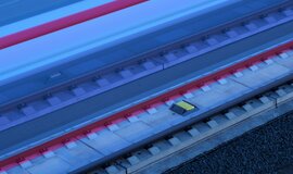 ICE runs fast on track. On the track is an ETCS construction